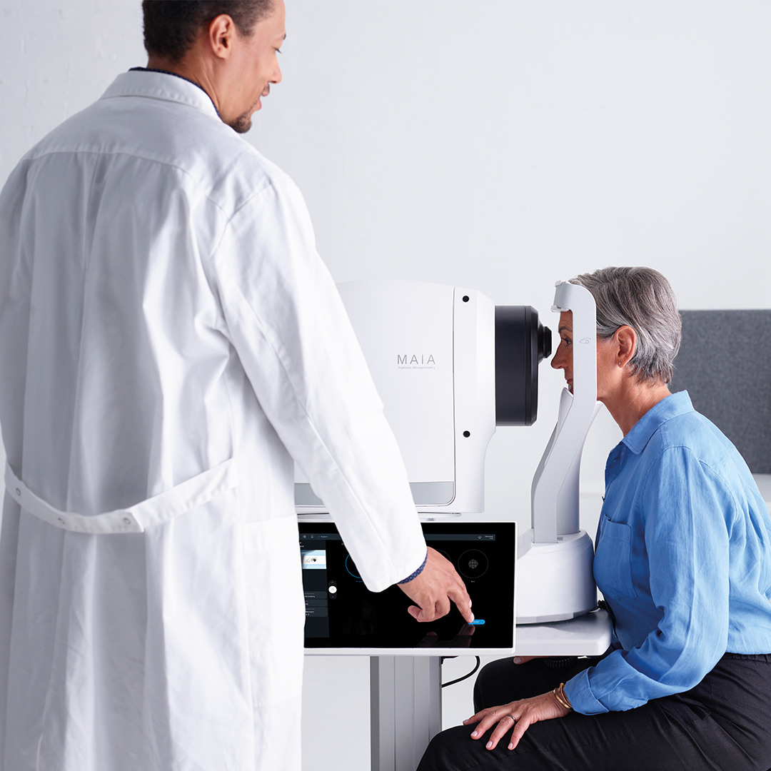 Doctor performing iCare MAIA microperimetry exam with patient